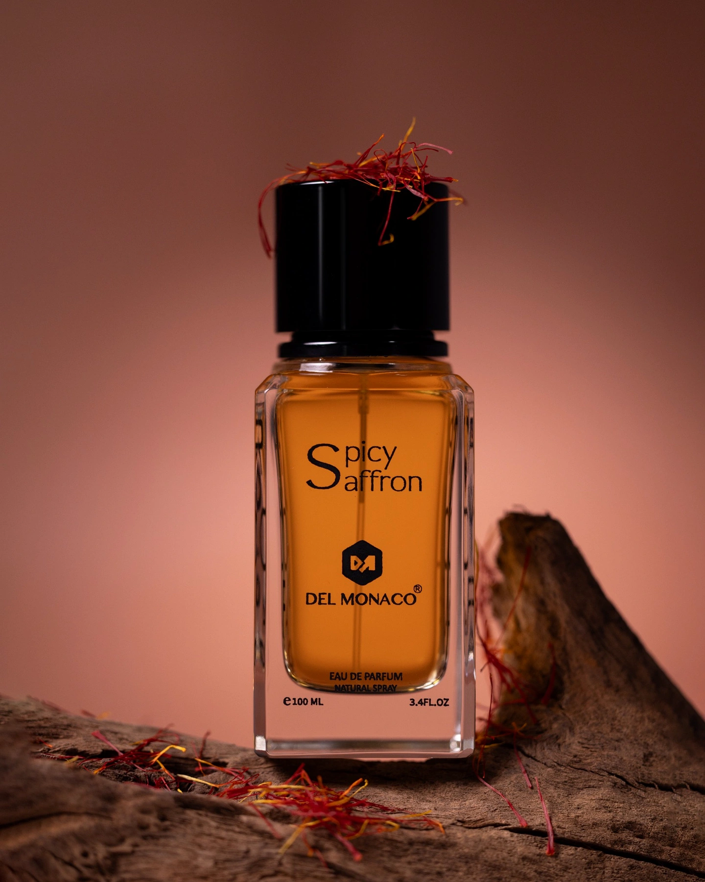 Real Spicy Saffron Del Monaco perfume bottle styled with saffron and wood